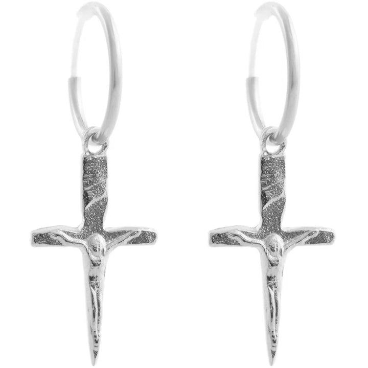 handmade crucifix shaped pendants in sterling silver hanging from a silver hoop